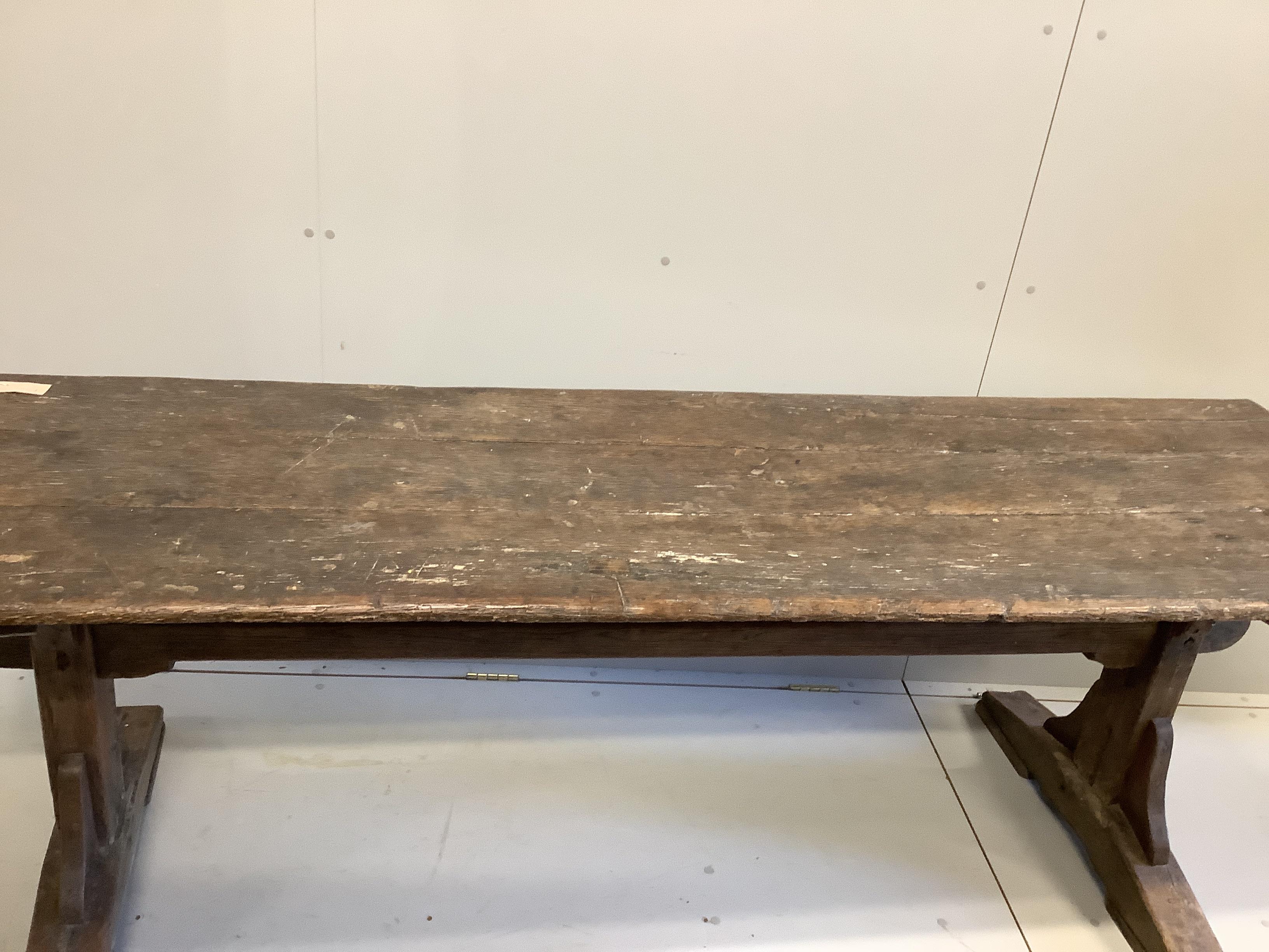An 18th century and later rectangular oak plank top refectory table, length 226cm, depth 66cm, height 72cm